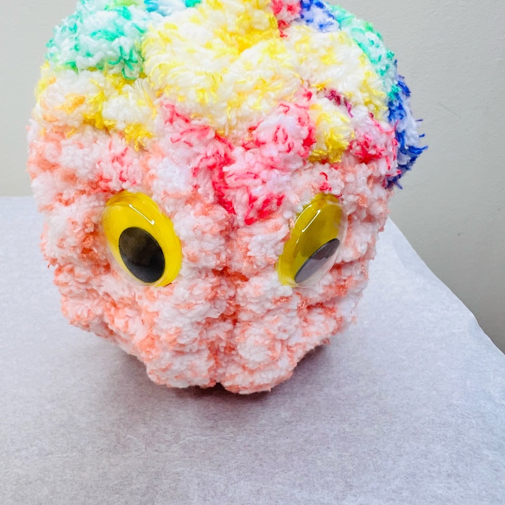 Colorful Plush Toy with Yellow Eyes